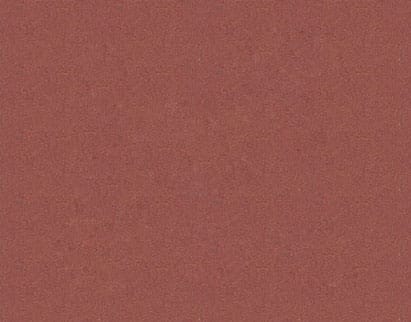 Close-up of a coarse-textured surface in a deep red color, with slight variations in shade giving a mottled appearance.