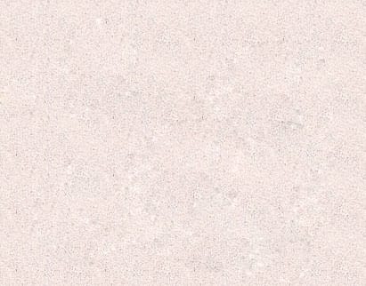 Close-up of a textured light beige surface with a speckled pattern, resembling fine sand or a concrete finish with small aggregates distributed throughout.