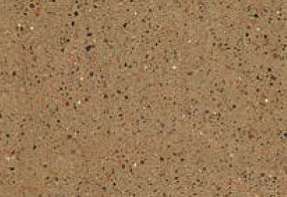 Close-up texture of a speckled tan surface, possibly a material like paper, fabric, or a fine-grained sandstone, with small flecks of red, white, and black distributed throughout.