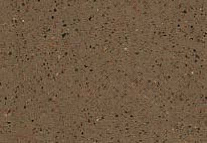 Close-up view of a granular gray surface with a fine distribution of black, white, and occasional colored specks.