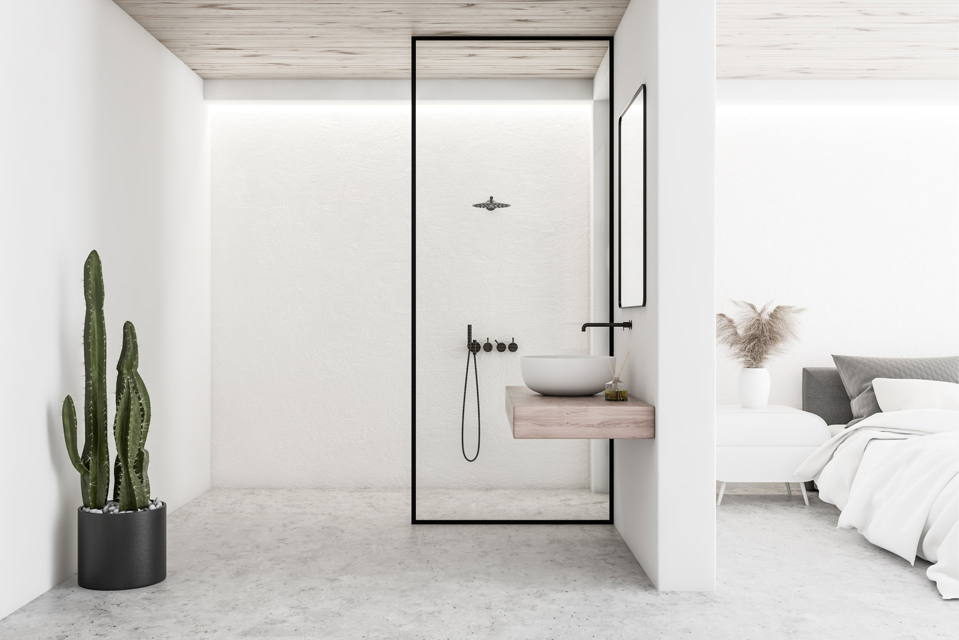 Minimalist interior design of a bedroom with an adjoining open bathroom. The bedroom features a low-profile bed with soft linens, while the bathroom includes a modern basin on a wooden shelf, black fixtures, and a glass shower partition. A tall cactus plant adds a touch of greenery to the neutral color scheme.